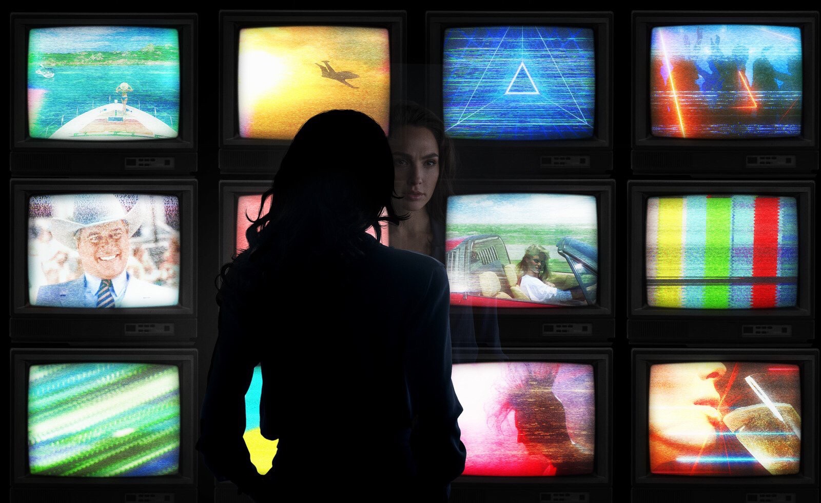 WW84 Wonder Woman staring at screens